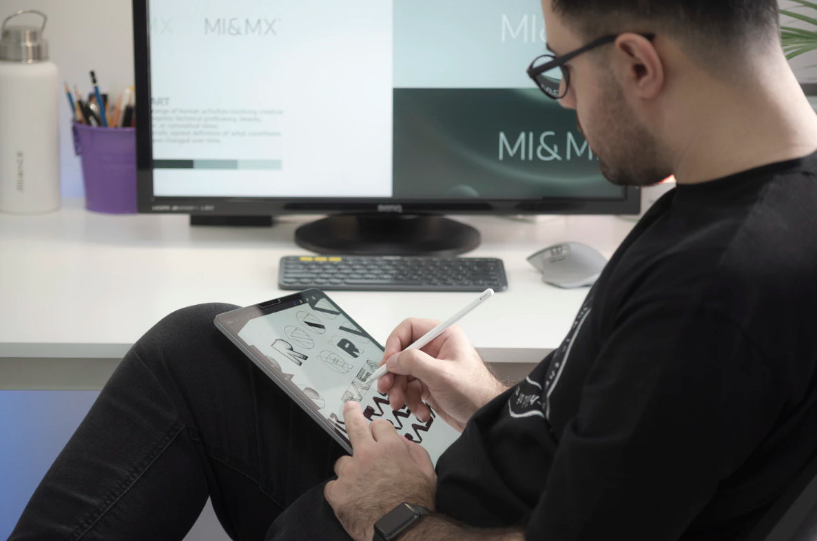 graphic designer creating an art on his tablet