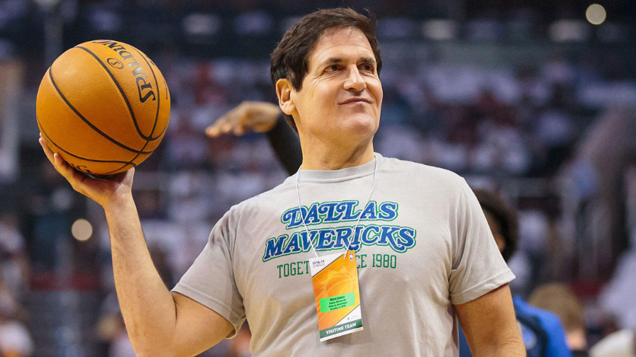 Mark Cuban holding a basketball emphasis on relating principles of sports with business